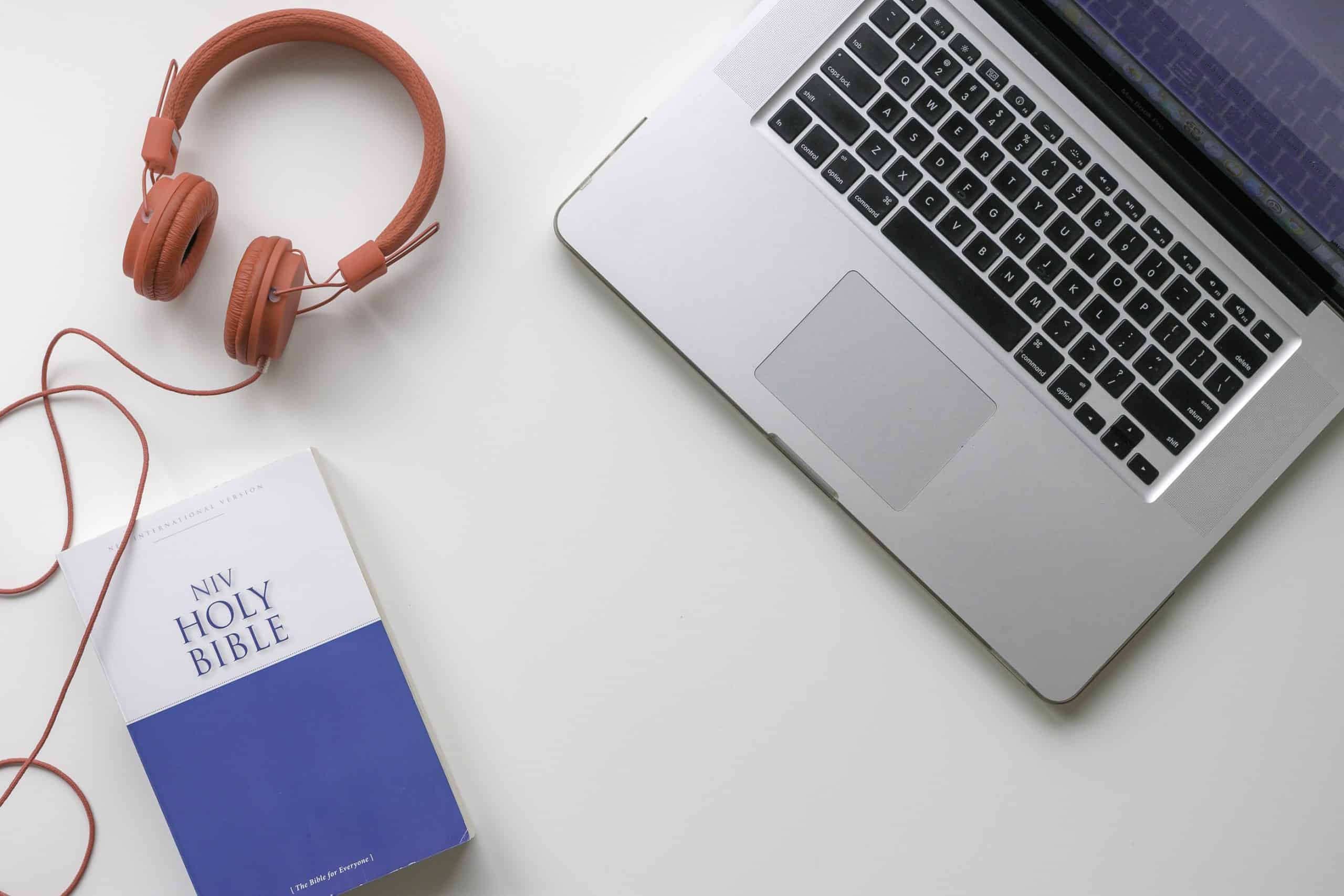 Bible and laptop on desk